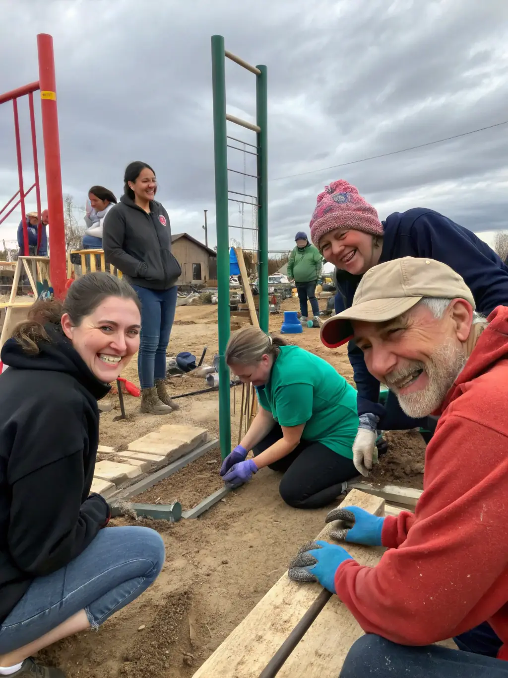 A photograph capturing a diverse group of community members actively participating in the creation of a scenographic installation at a local heritage site, showcasing collaboration and engagement.
